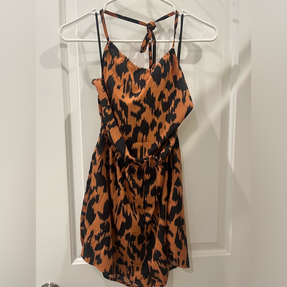 Cutest cheetah halter romper. Good for a night out or girls brunch.